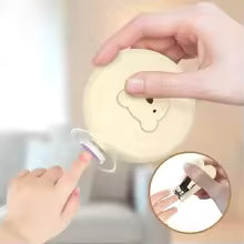 Parent gently trimming a baby's nails using the Bloom & Bear electric nail trimmer
