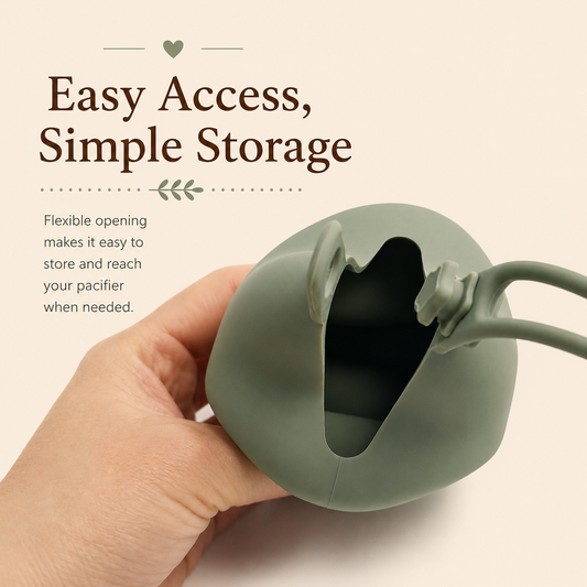 Sage green silicone pacifier case held open by hand, showing the flexible opening designed for easy pacifier storage and access.