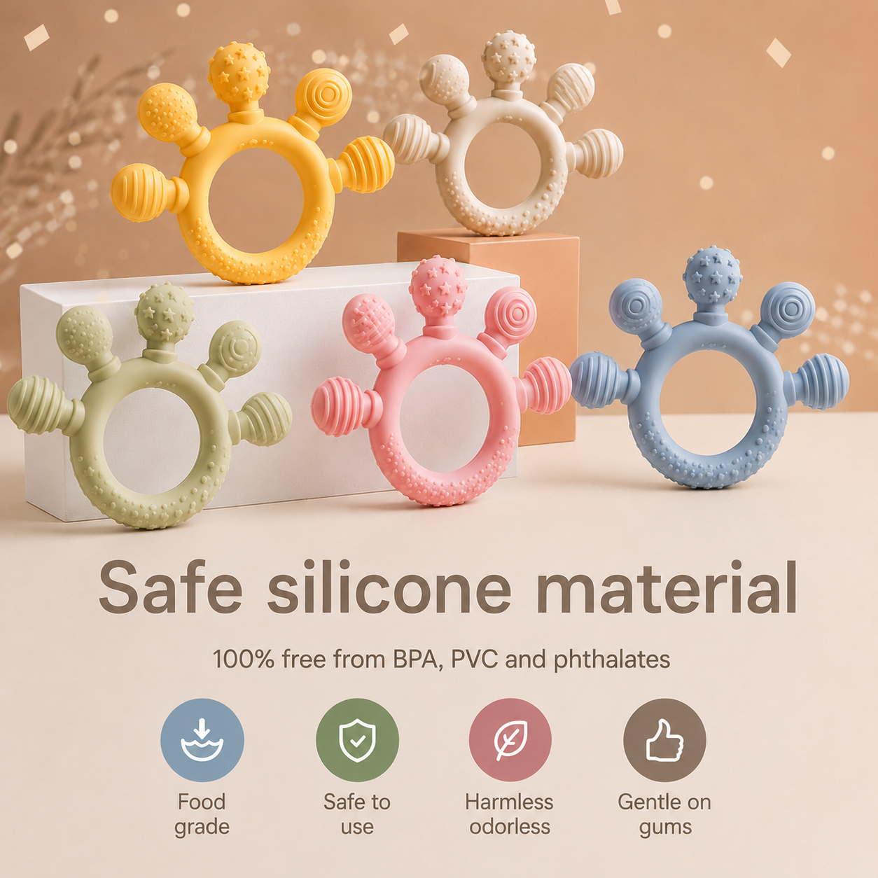 Pastel silicone baby teethers in multiple colors with textured surfaces designed for little hands and gums.